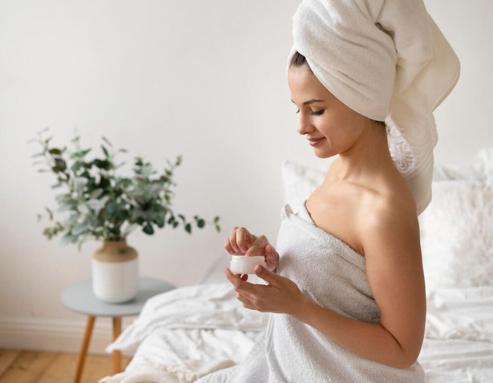 Woman-gently-applying-moisturizer-to-her-face