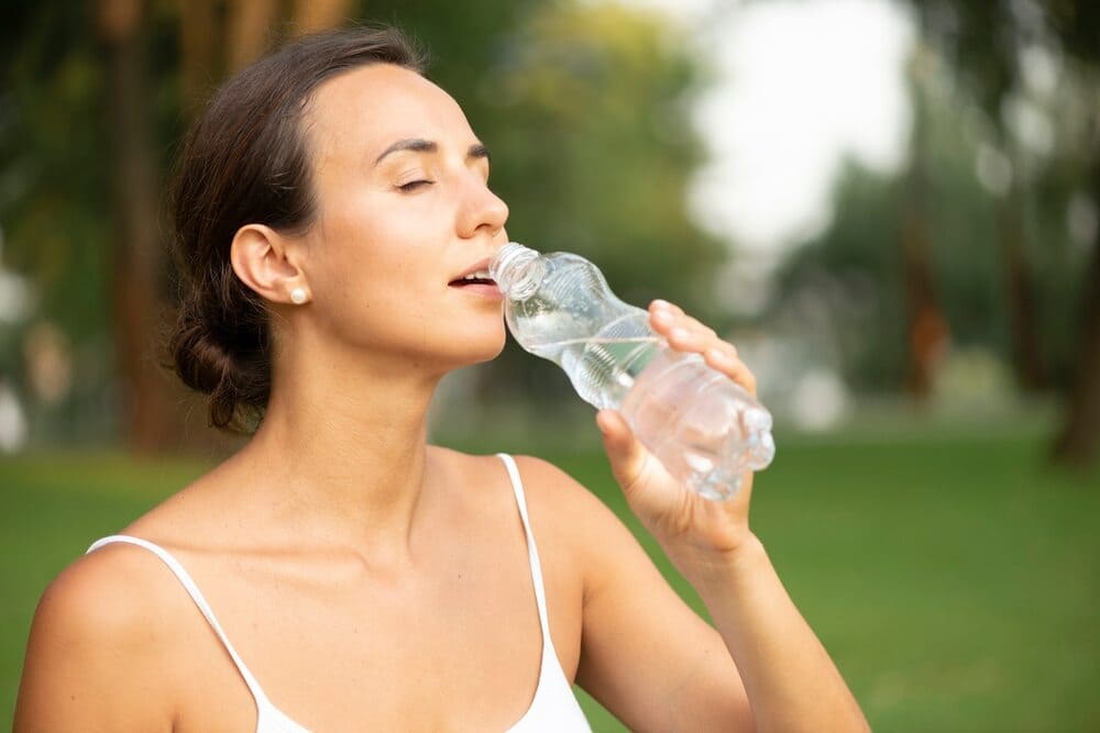 side-view-woman-drinking-water